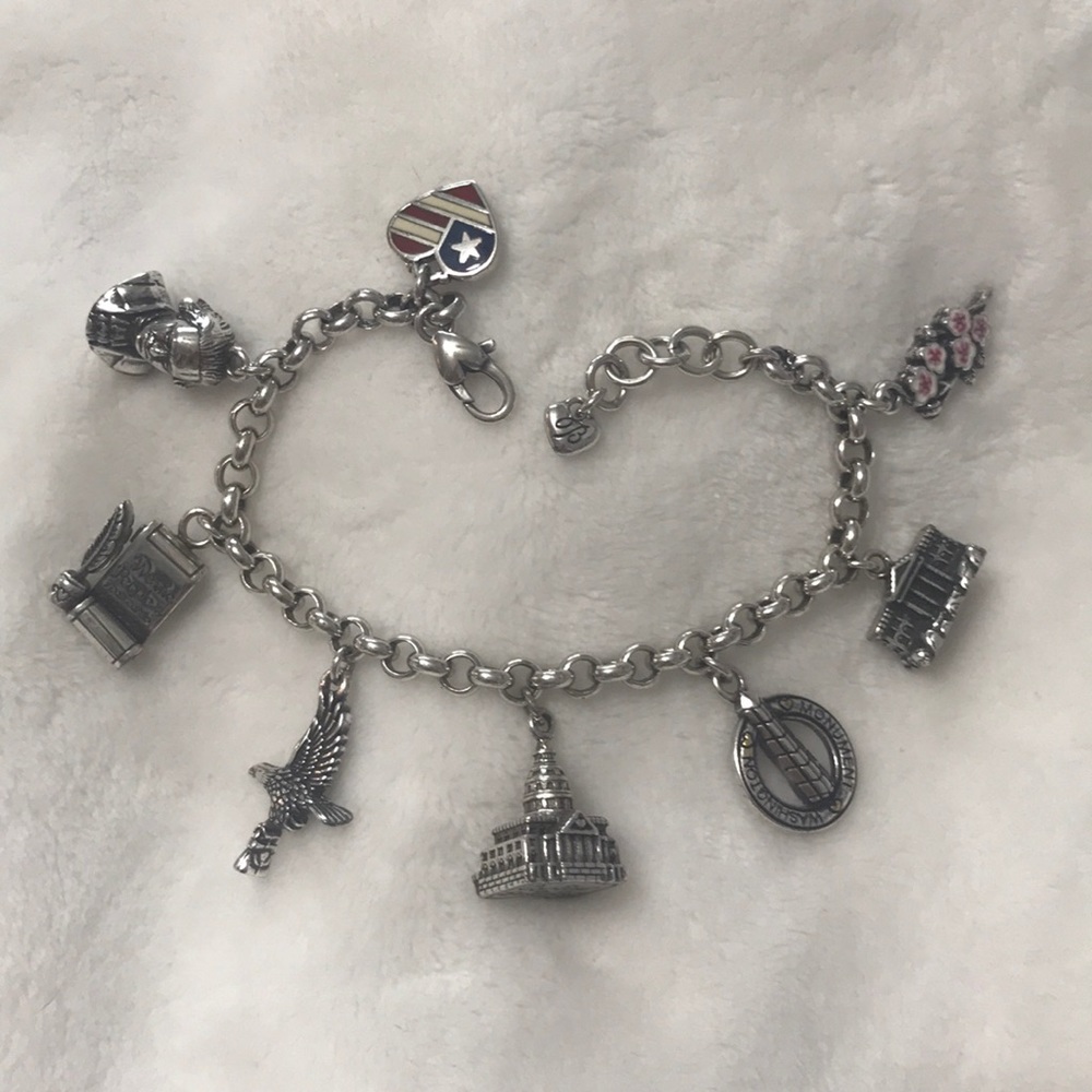 8 charm Brighton bracelet representing DC